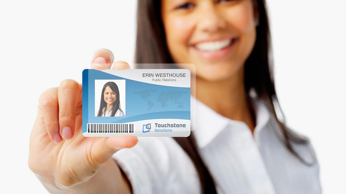 Woman holding ID Card